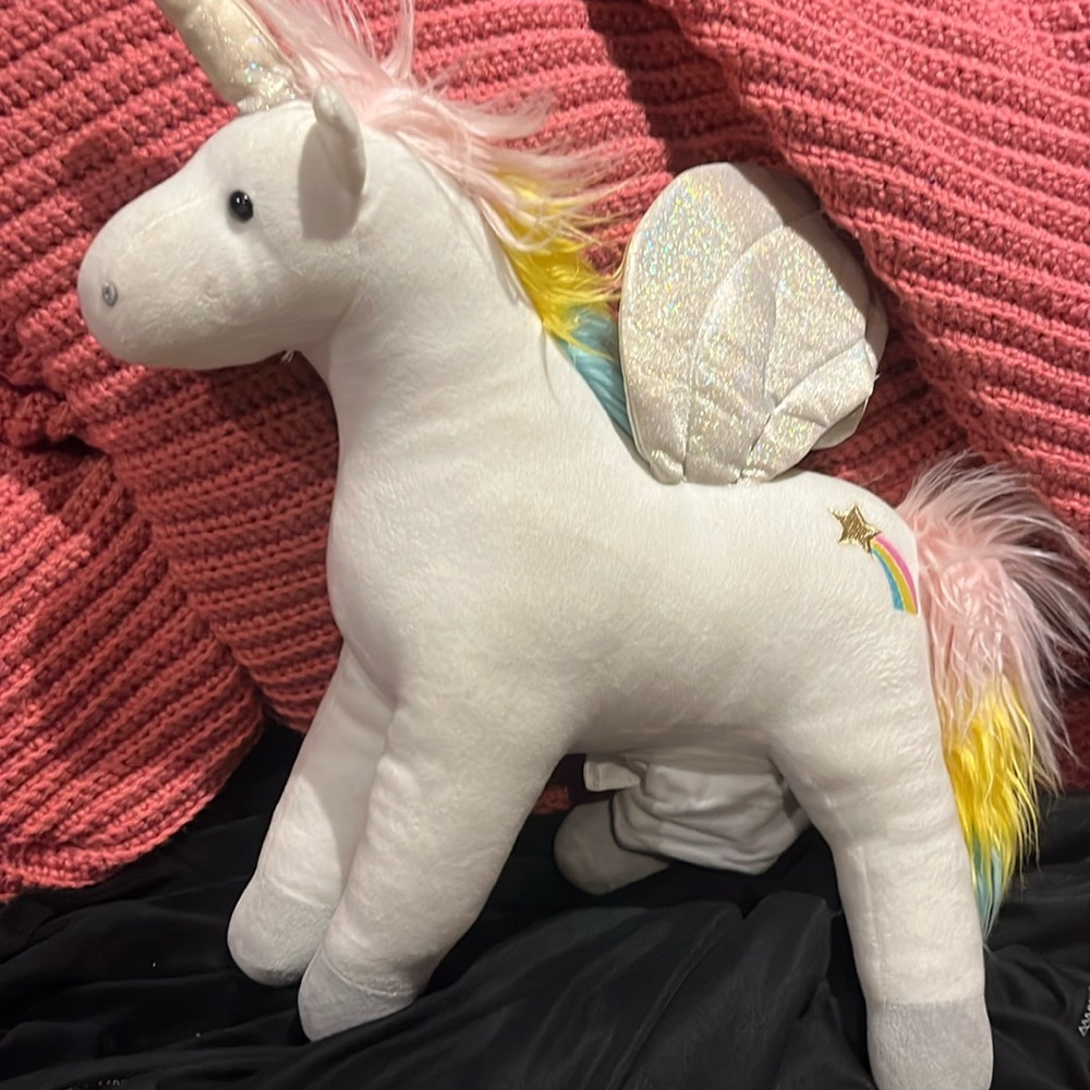 A unicorn it lights up the wings once you press the bottom to turn it on